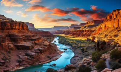 Image of the Colorado River running through The Grand Canyon, as seen from a hiker's perspective.